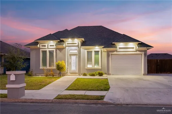 a front view of a house with yard