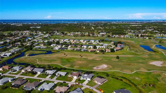 an aerial view of residential building and lake