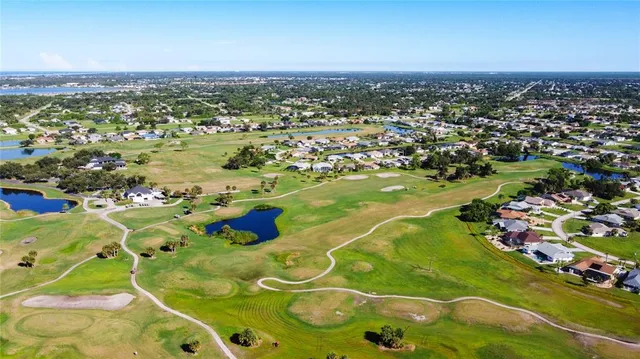 an aerial view of residential houses with city view
