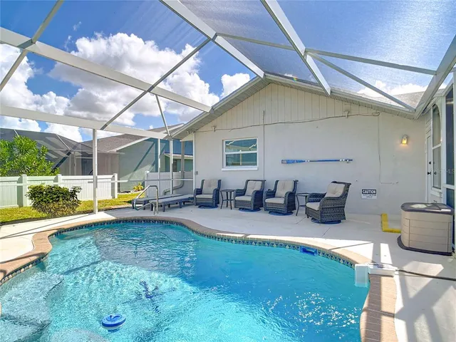 a view of a patio with table and chairs and potted plants