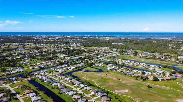 a living room with furniture or chandelier and a flat screen tv