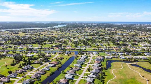 a kitchen with stainless steel appliances white cabinets and a refrigerator