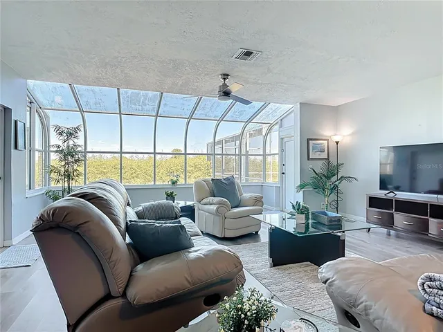 a room with a table chairs and wooden floor