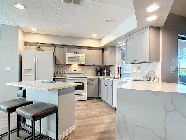 a bathroom with a toilet sink and shower