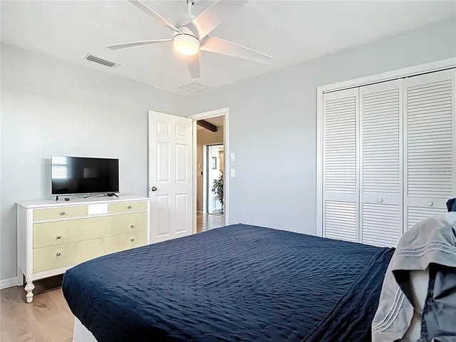 a view of a house with backyard porch and sitting area