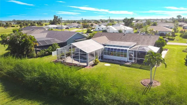an aerial view of a house with a garden