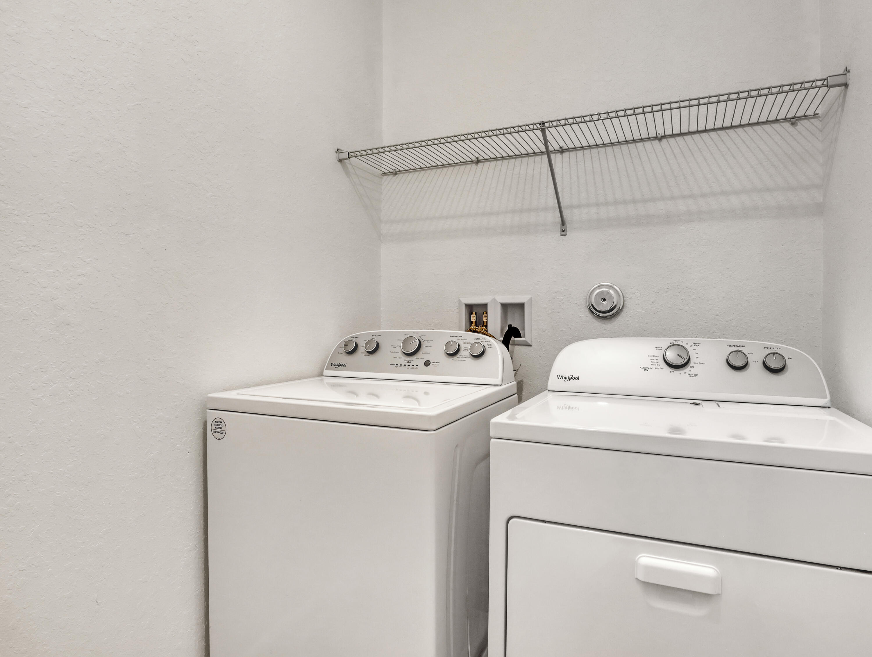 9508 Southwest Otter Lane Stuart, FL 34997 - Photo 16 of 34 a utility room with dryer and washer