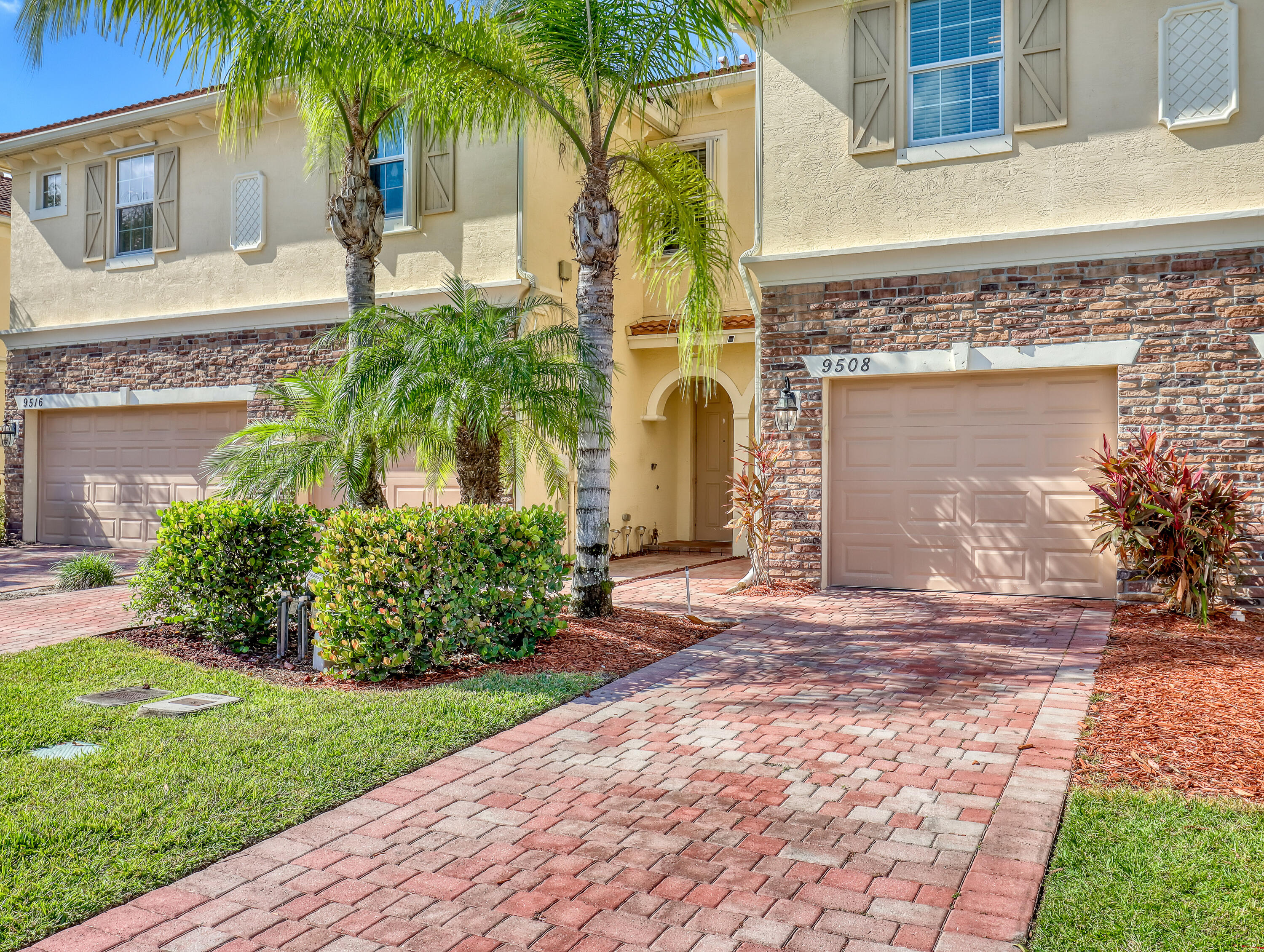 9508 Southwest Otter Lane Stuart, FL 34997 - Photo 2 of 34 a front view of a house with garden