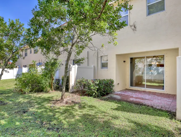 a view of a swimming pool with an outdoor seating
