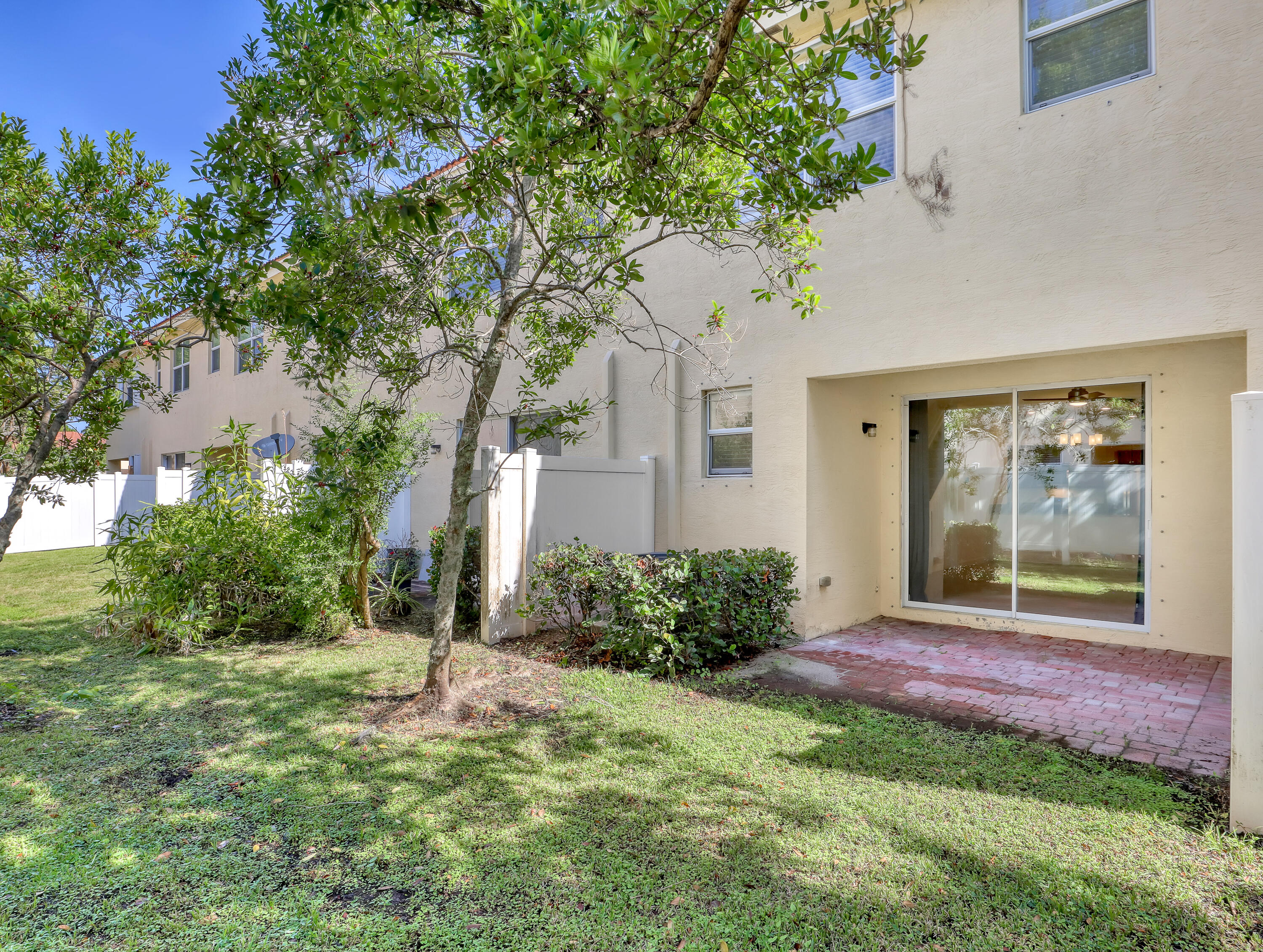 9508 Southwest Otter Lane Stuart, FL 34997 - Photo 32 of 34 a front view of a house with garden