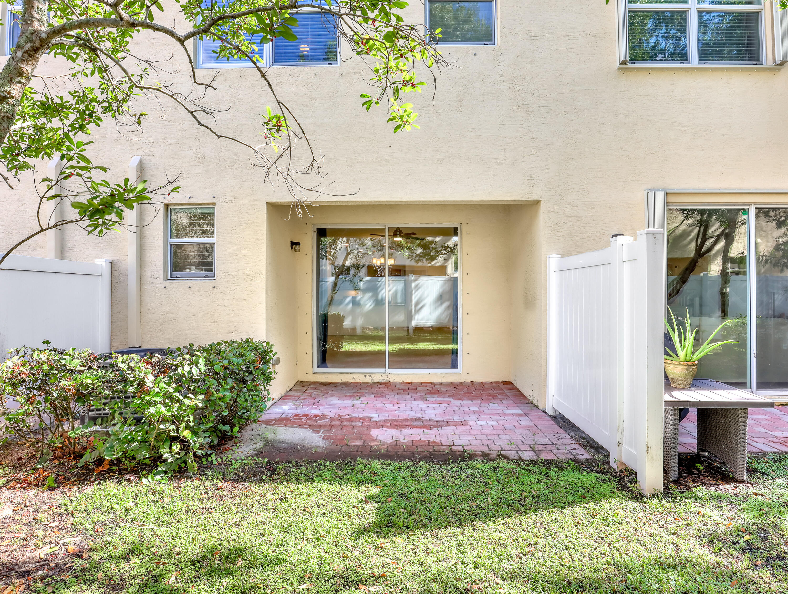 9508 Southwest Otter Lane Stuart, FL 34997 - Photo 33 of 34 a front view of a house with a yard