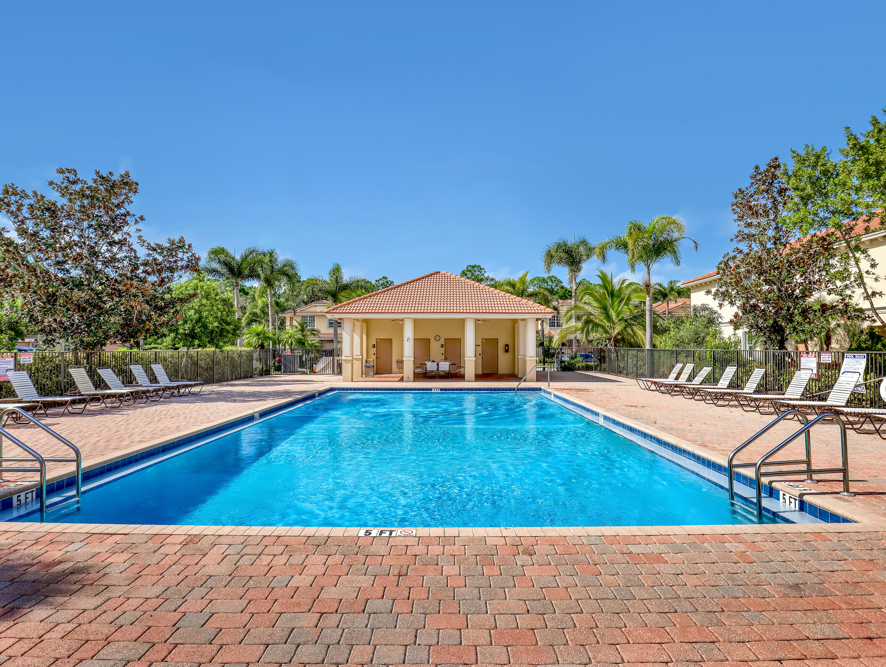 9508 Southwest Otter Lane Stuart, FL 34997 - Photo 34 of 34 a view of a swimming pool with an outdoor seating