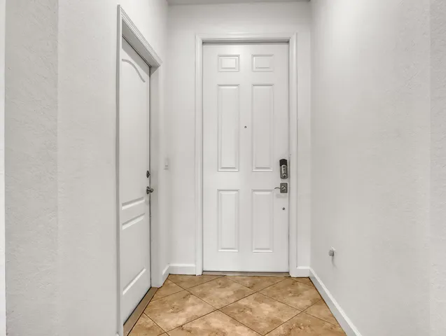 a kitchen with stainless steel appliances granite countertop a sink and a stove