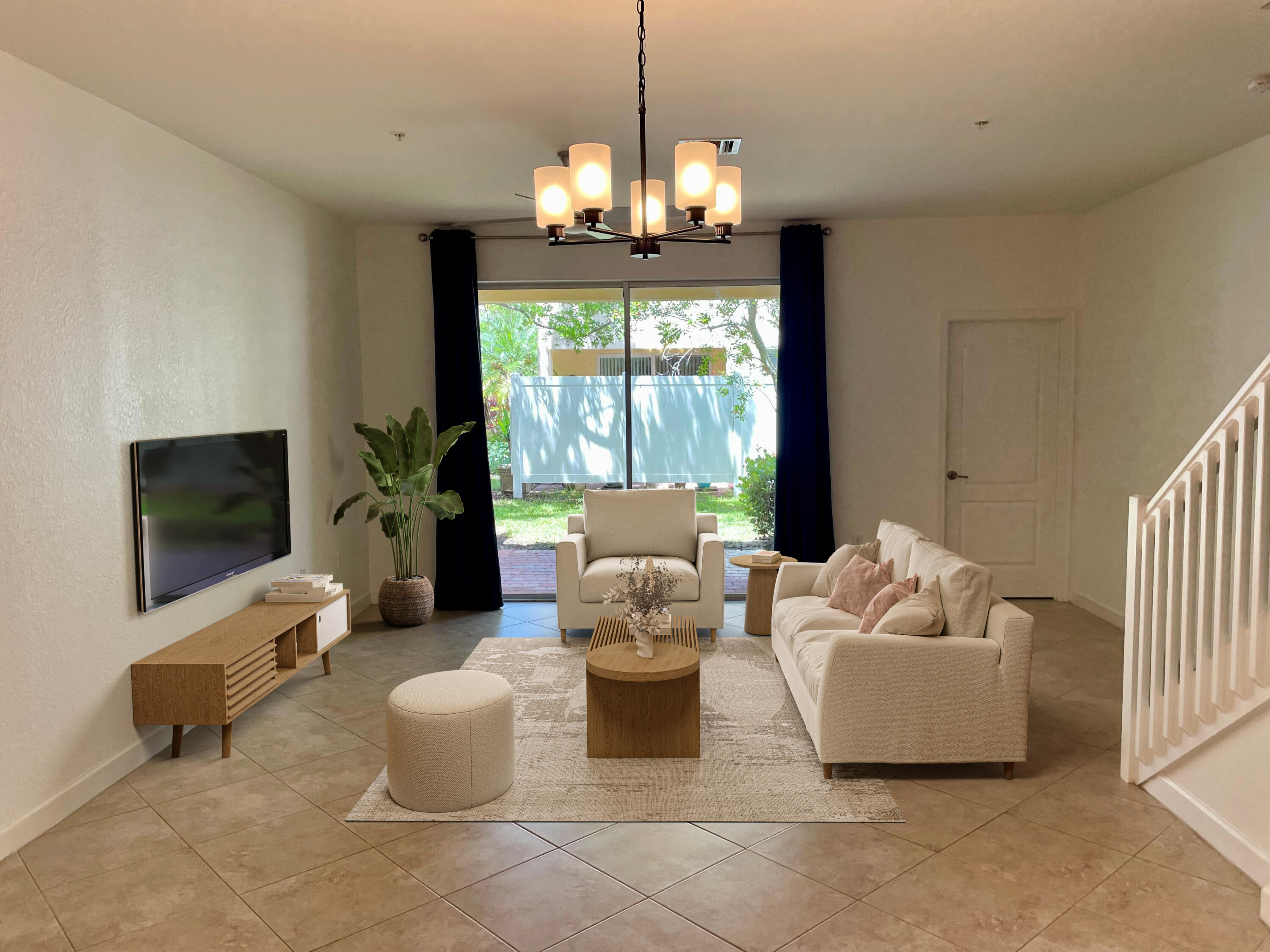 9508 Southwest Otter Lane Stuart, FL 34997 - Photo 8 of 34 a living room with furniture and a flat screen tv