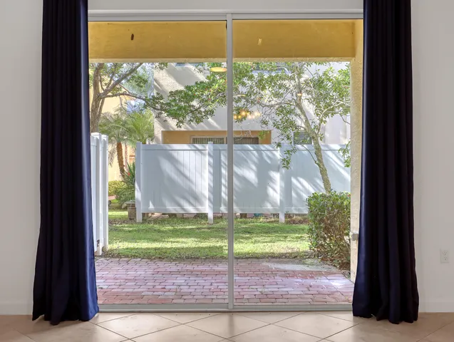 a view of kitchen and kitchen with microwave