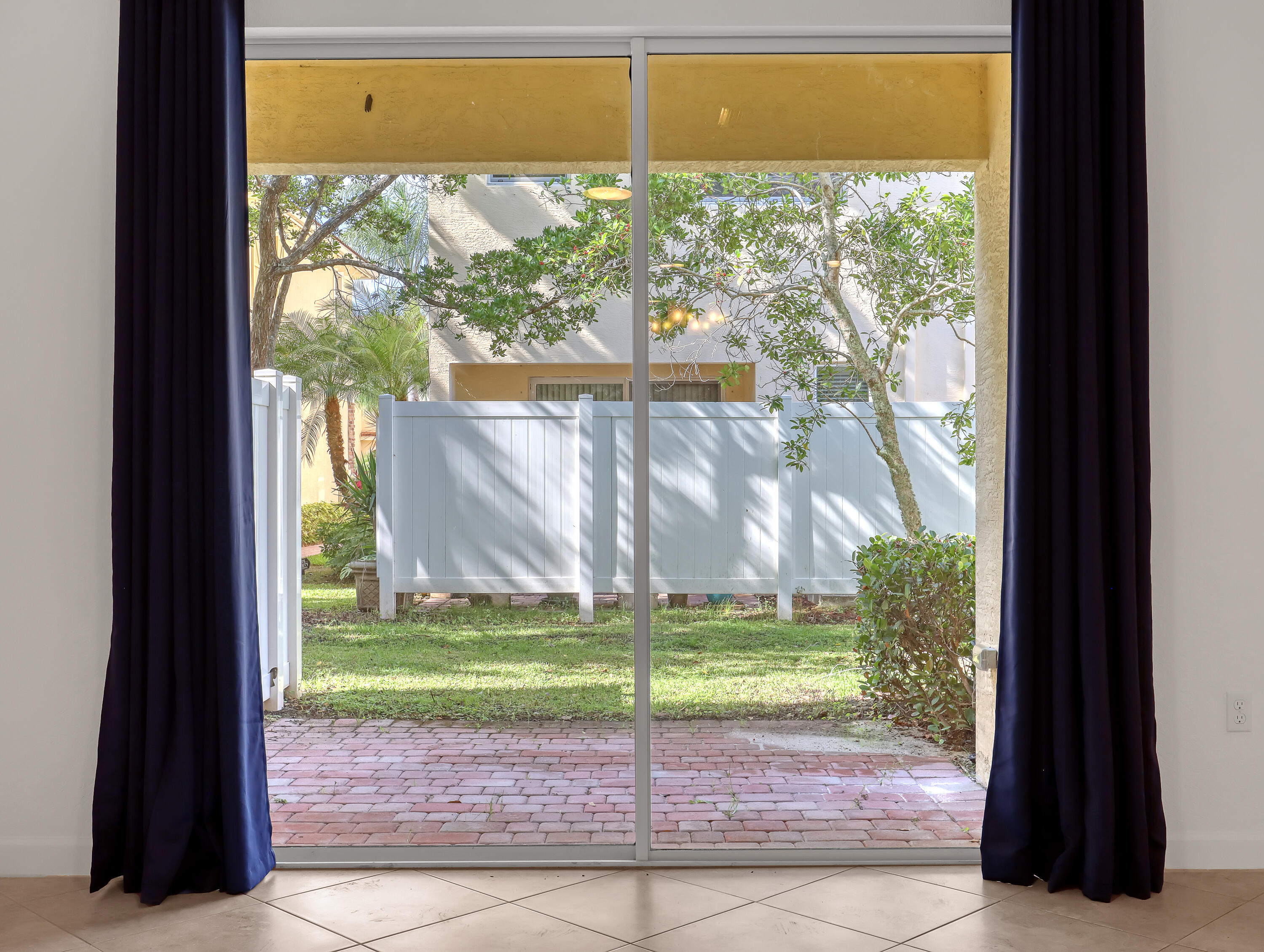 9508 Southwest Otter Lane Stuart, FL 34997 - Photo 9 of 34 a view of a back yard from a room