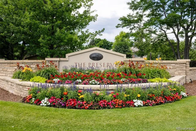 an aerial view of residential houses with outdoor space and street view