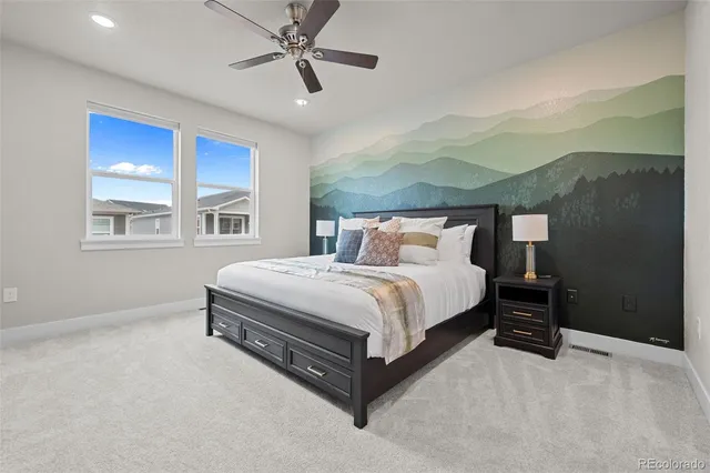 a bedroom with a bed lamp closet and window