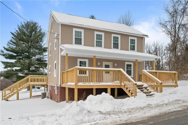 a front view of a house with a yard
