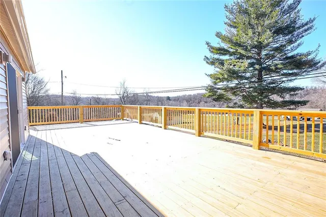 a view of empty room with wooden walls