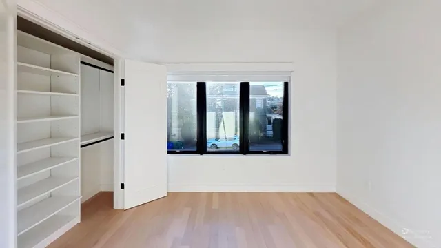 a bathroom with a double vanity sink mirror and bathtub