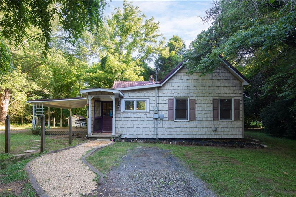 a front view of a house with yard