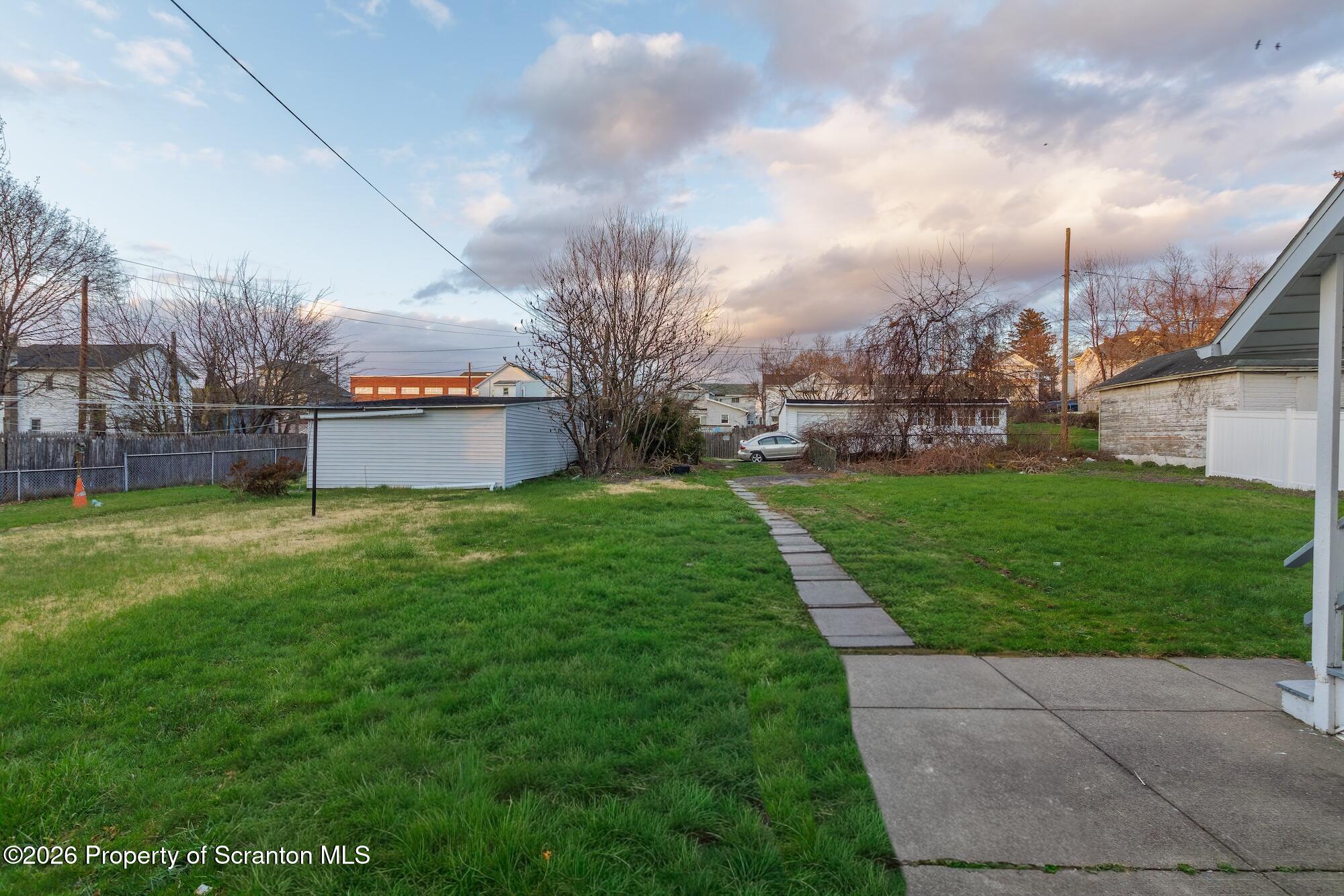 623 East Elm Street, Unit 3 Scranton, PA 18505 - Photo 18 of 18 a view of a garden with a building in the background
