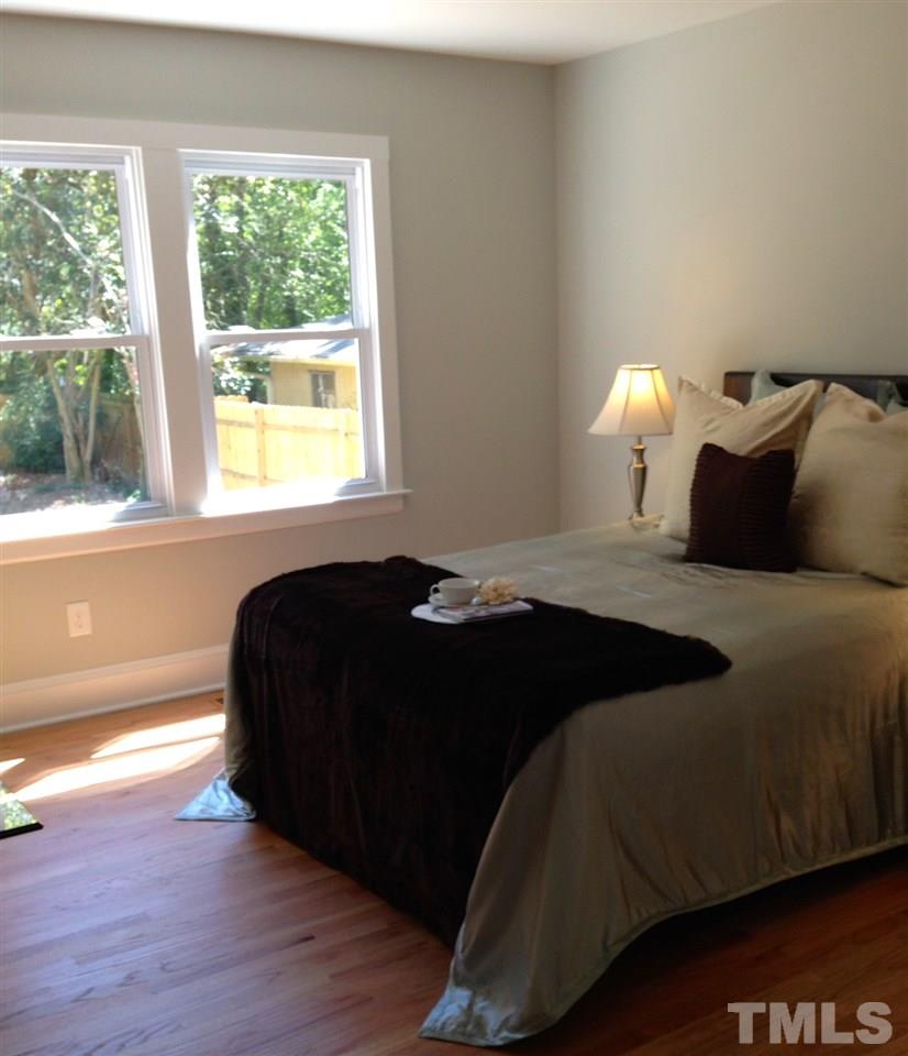 1113 Fairview Street Durham, NC 27707 - Photo 14 of 25 a bedroom with a bed and a window