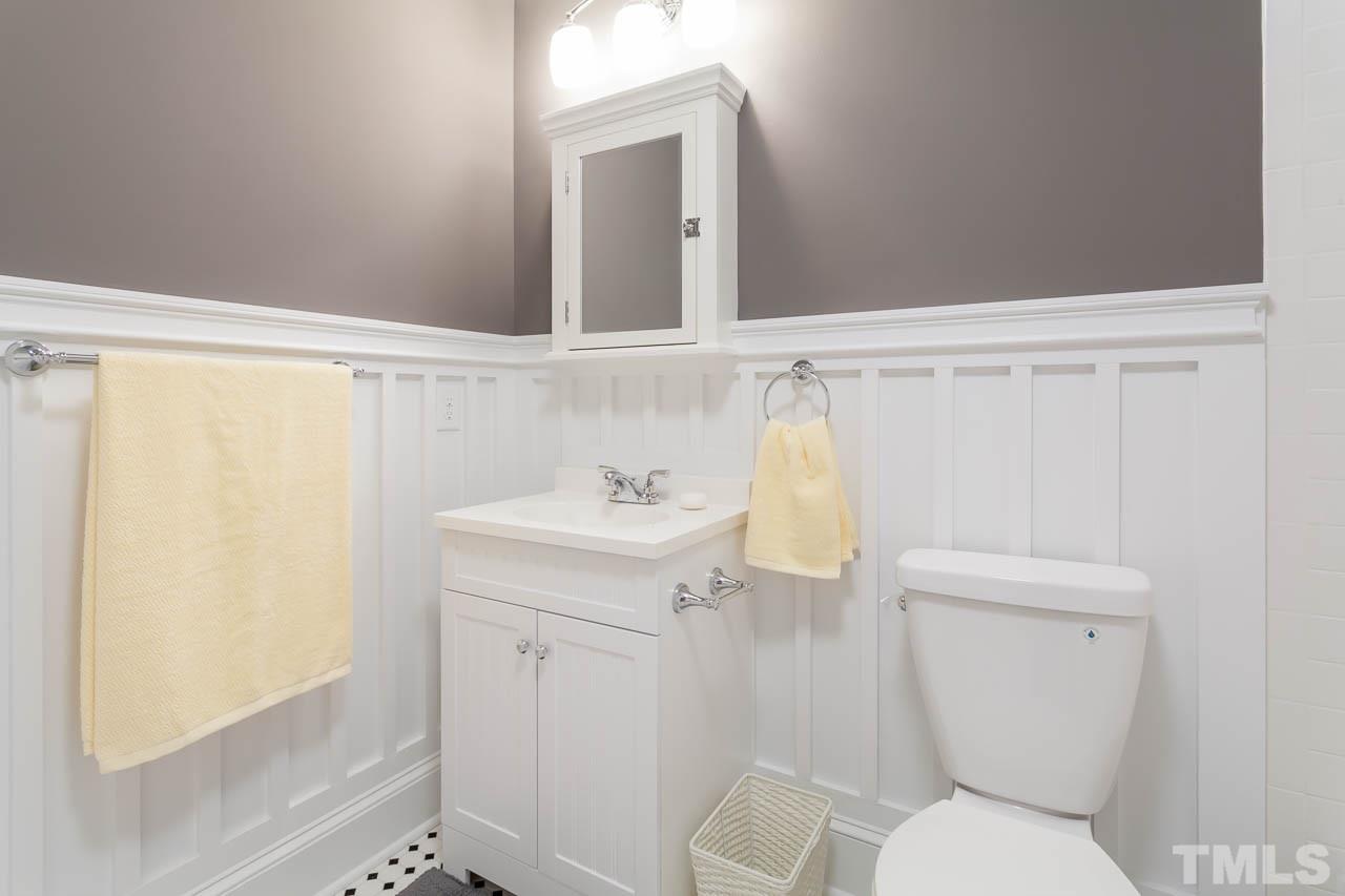 1113 Fairview Street Durham, NC 27707 - Photo 15 of 25 a white toilet sitting next to a bathroom sink