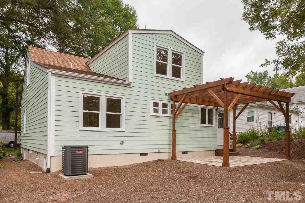 1113 Fairview Street Durham, NC 27707 - Photo 23 of 25 a view of a house with a patio and a yard