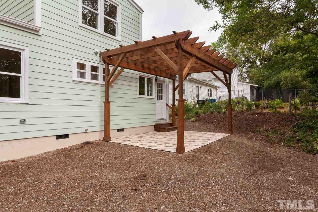 1113 Fairview Street Durham, NC 27707 - Photo 24 of 25 a backyard of a house with a tree