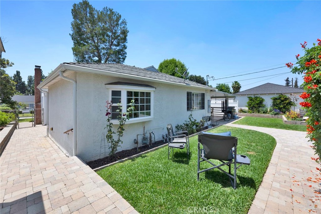 5456 Cadbury Road Whittier, CA 90601 - Photo 59 of 67 a view of a house with backyard sitting area and garden