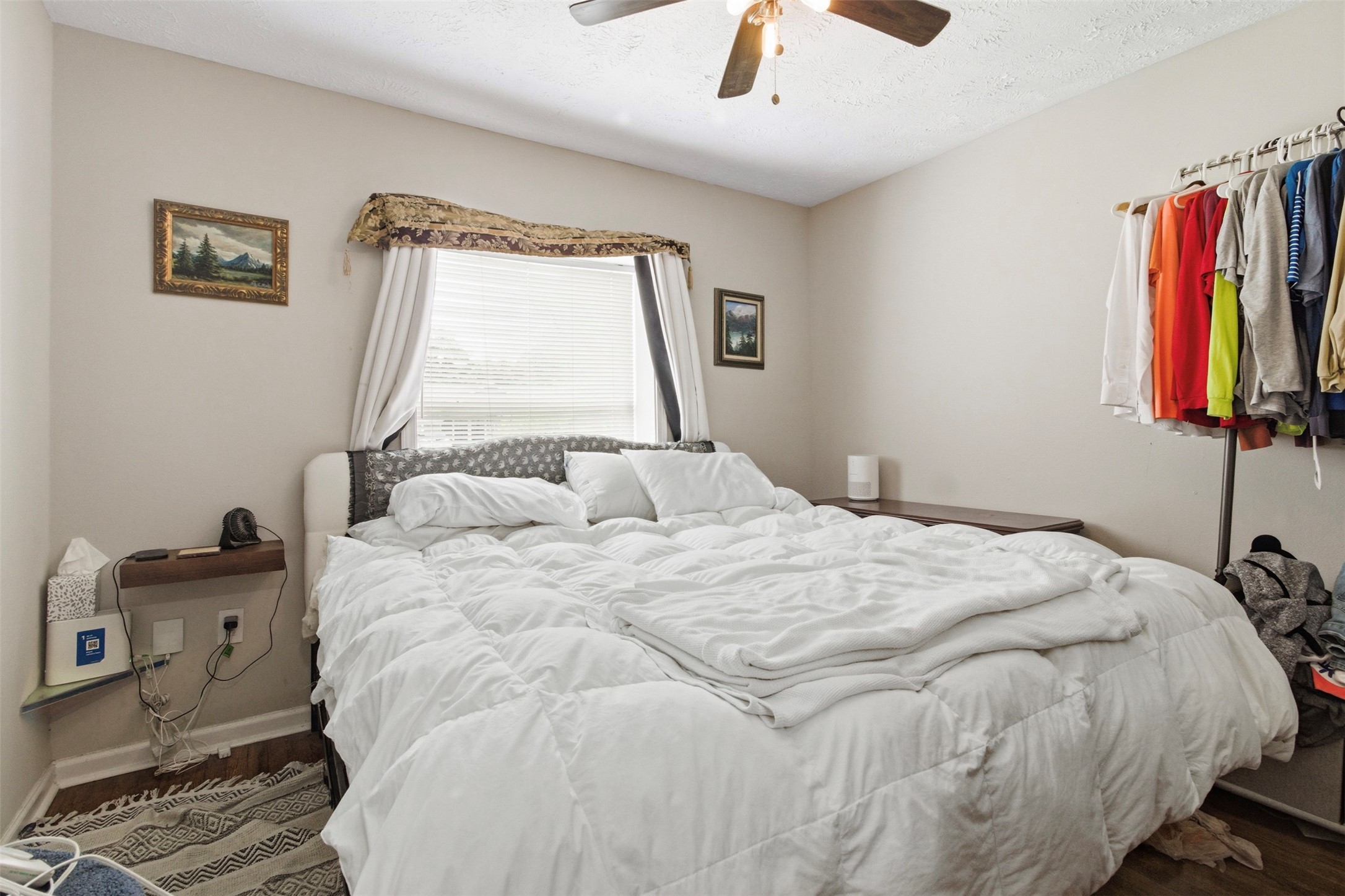 306 Center Street Pasadena, TX 77506 - Photo 15 of 31 a large bed sitting in a bedroom next to a window