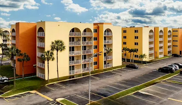 an aerial view of a residential houses with outdoor space