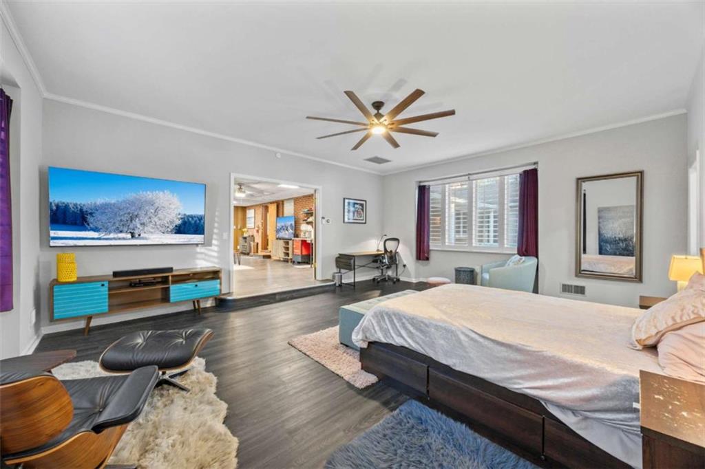 200 McGuirts Bridge Road Covington, GA 30014 - Photo 20 of 100 a bedroom with a bed a couch and dresser