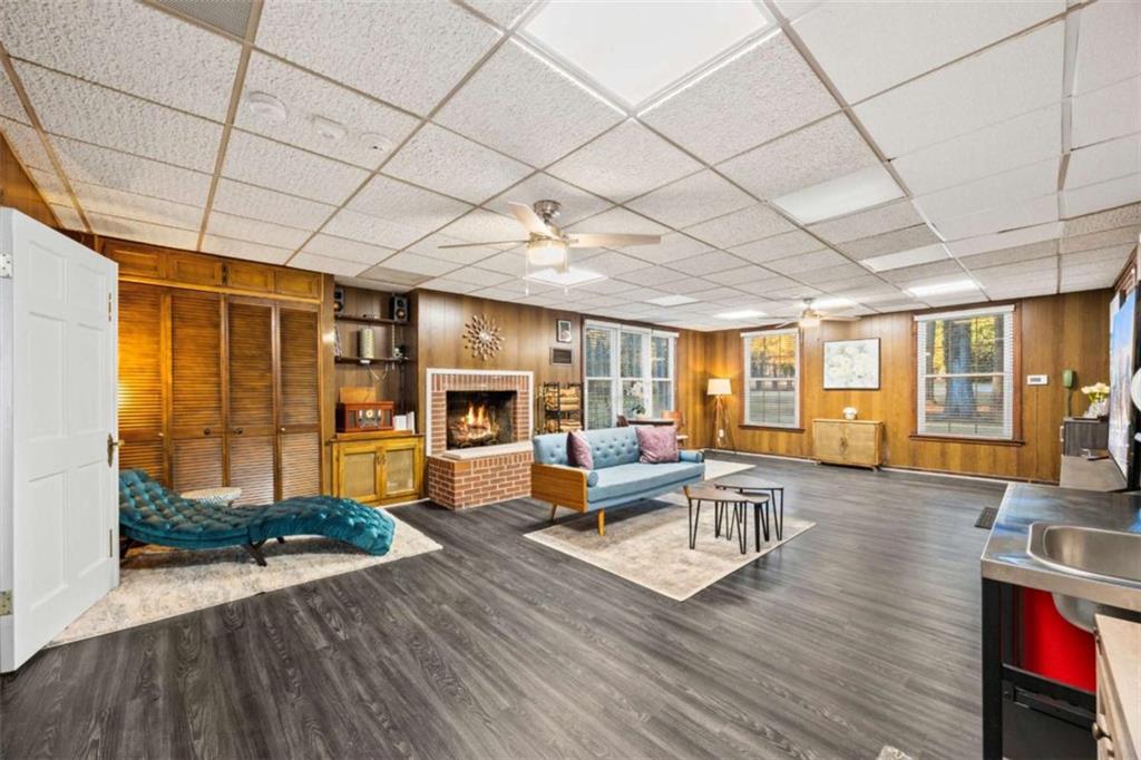200 McGuirts Bridge Road Covington, GA 30014 - Photo 23 of 100 a living room with furniture a wooden floor and next to a window