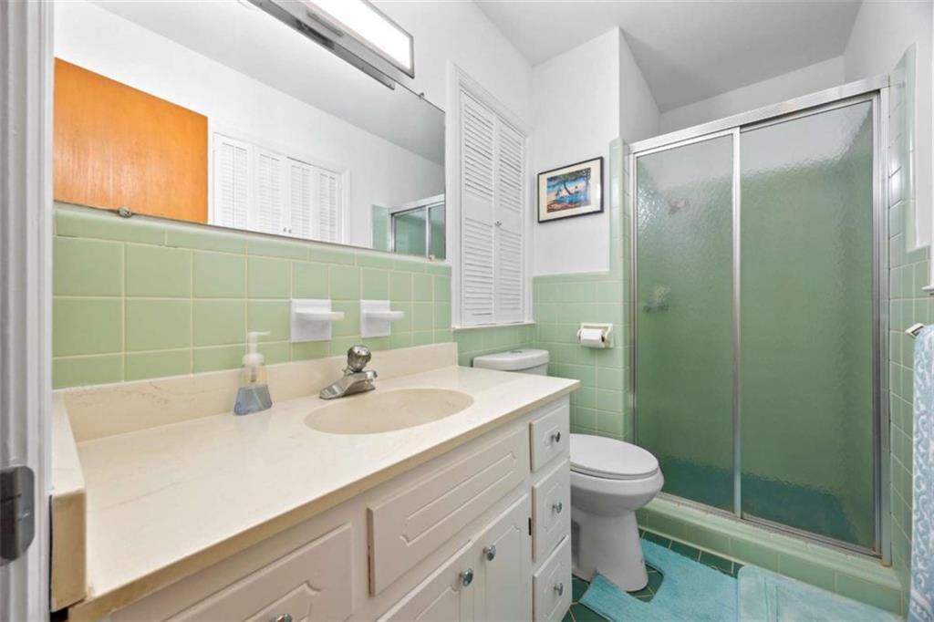 200 McGuirts Bridge Road Covington, GA 30014 - Photo 26 of 100 a bathroom with a sink a toilet and shower