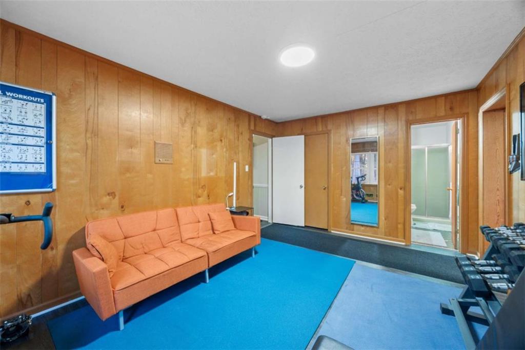 200 McGuirts Bridge Road Covington, GA 30014 - Photo 27 of 100 a spacious bedroom with a bed and a couch