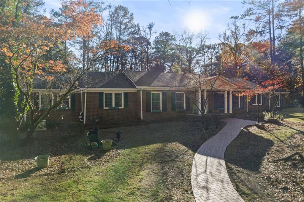 200 McGuirts Bridge Road Covington, GA 30014 - Photo 3 of 100 a front view of a house with a yard