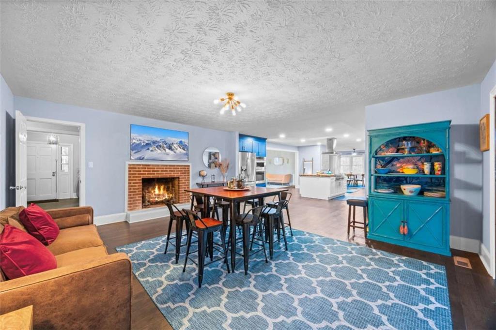 200 McGuirts Bridge Road Covington, GA 30014 - Photo 37 of 100 a living room with furniture a dining table and a bookshelf