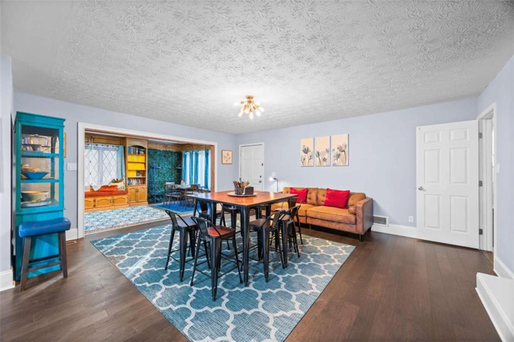 200 McGuirts Bridge Road Covington, GA 30014 - Photo 41 of 100 a view of a dining room with furniture window and wooden floor