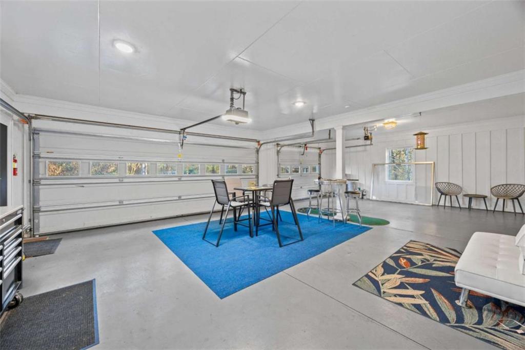 200 McGuirts Bridge Road Covington, GA 30014 - Photo 45 of 100 a living room with furniture a rug and kitchen view