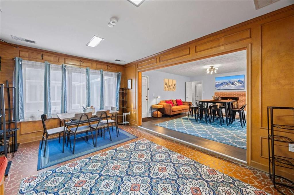 200 McGuirts Bridge Road Covington, GA 30014 - Photo 46 of 100 a living room with furniture a rug and a floor to ceiling window