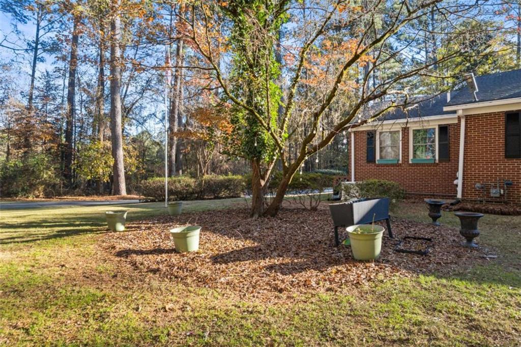 200 McGuirts Bridge Road Covington, GA 30014 - Photo 5 of 100 a view of a house with backyard and sitting area