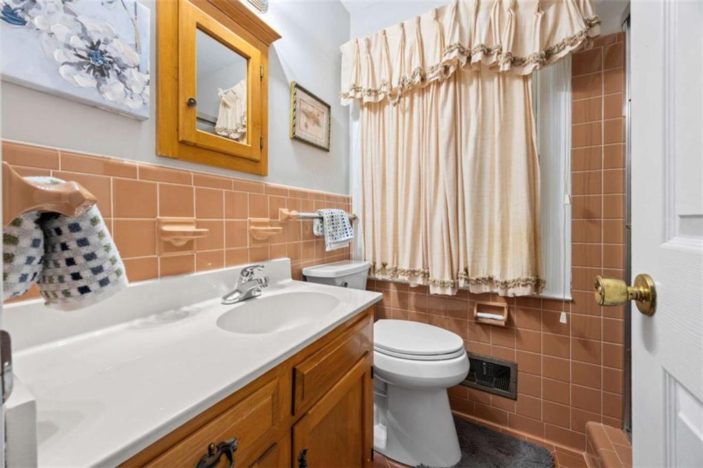 200 McGuirts Bridge Road Covington, GA 30014 - Photo 55 of 100 a bathroom with a sink toilet and shower