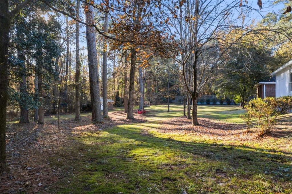 200 McGuirts Bridge Road Covington, GA 30014 - Photo 7 of 100 a view of a yard with swimming pool