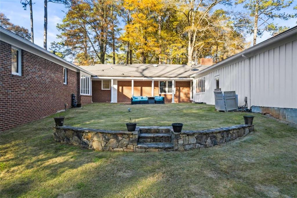 200 McGuirts Bridge Road Covington, GA 30014 - Photo 74 of 100 a view of a house with backyard and a tree