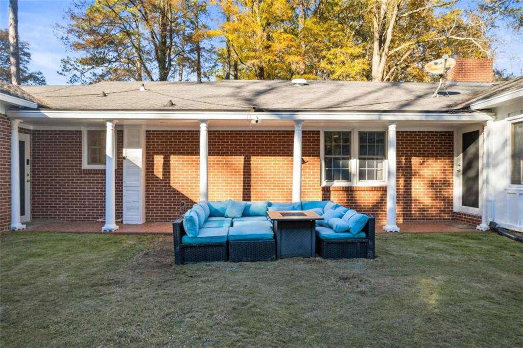 200 McGuirts Bridge Road Covington, GA 30014 - Photo 75 of 100 a view of a patio with couches chairs and a fire pit