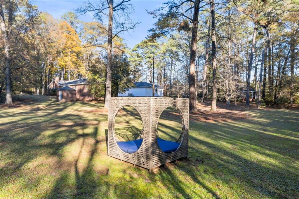 200 McGuirts Bridge Road Covington, GA 30014 - Photo 81 of 100 a view of a swimming pool with sitting area