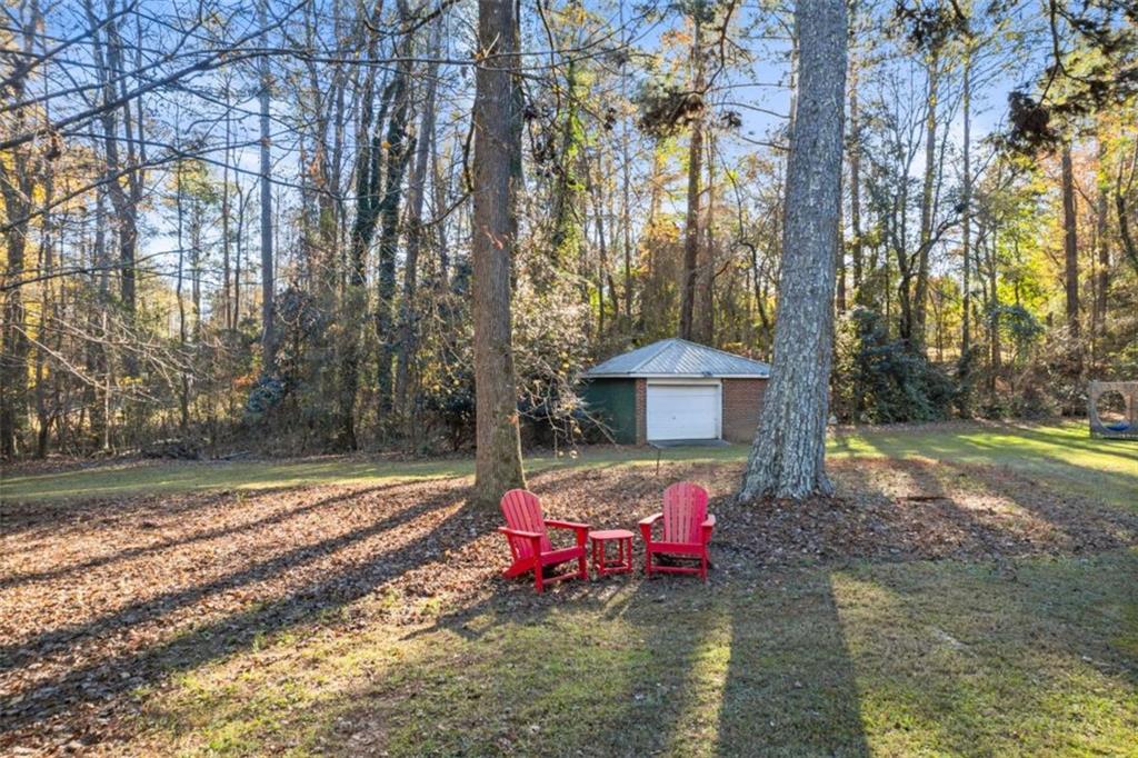 200 McGuirts Bridge Road Covington, GA 30014 - Photo 83 of 100 a view of a backyard with a small pool